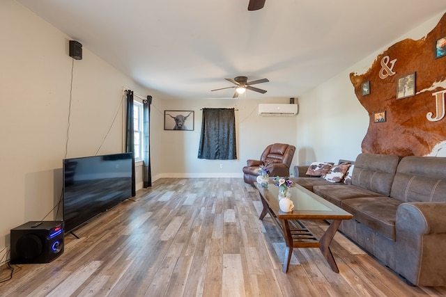 living room with hardwood / wood-style flooring, a wall mounted air conditioner, and ceiling fan