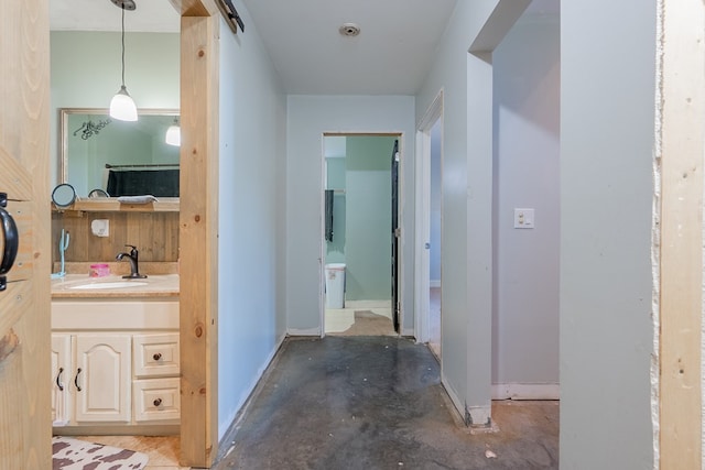 bathroom featuring vanity and concrete flooring