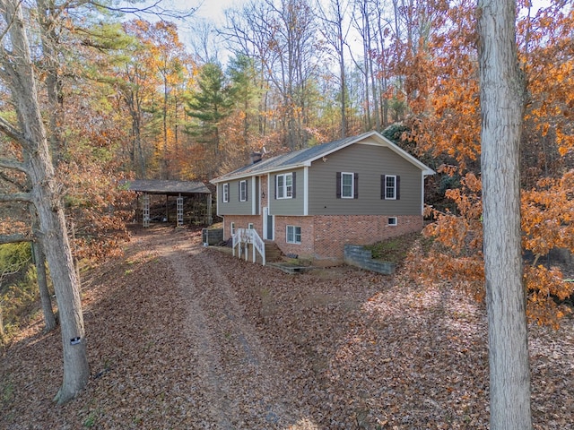 view of side of property featuring a carport