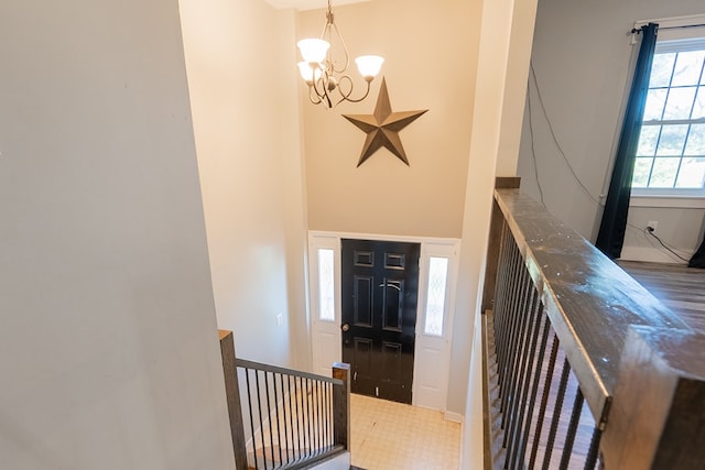 entryway with an inviting chandelier