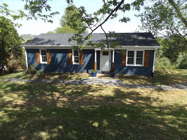 ranch-style house with a front lawn