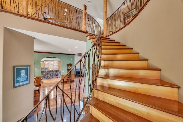 18549 Landridge Way, Abingdon, VA 24211 - stairway featuring arched walkways, wood finished floors, and a towering ceiling