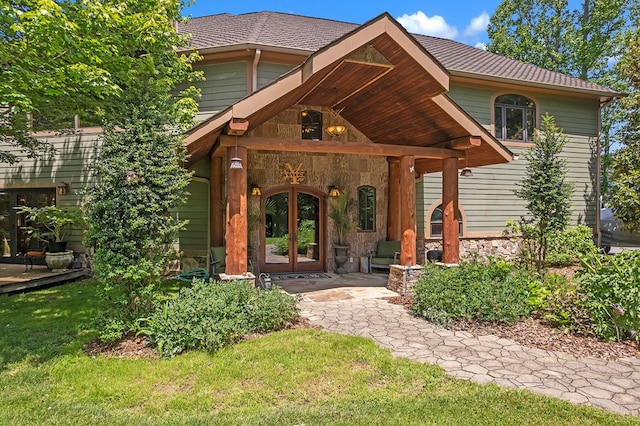 18549 Landridge Way, Abingdon, VA 24211 - view of exterior entry with french doors, stone siding, and a yard