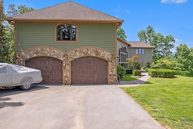 18549 Landridge Way, Abingdon, VA 24211 - view of front of house with stone siding, an attached garage, asphalt driveway, and a front lawn
