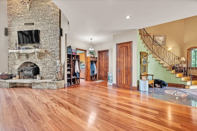 18549 Landridge Way, Abingdon, VA 24211 - living area with hardwood / wood-style flooring, a wood stove, and stairway