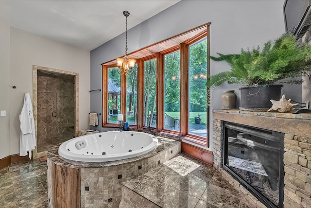 18549 Landridge Way, Abingdon, VA 24211 - full bath featuring plenty of natural light, a jetted tub, a glass covered fireplace, and a chandelier