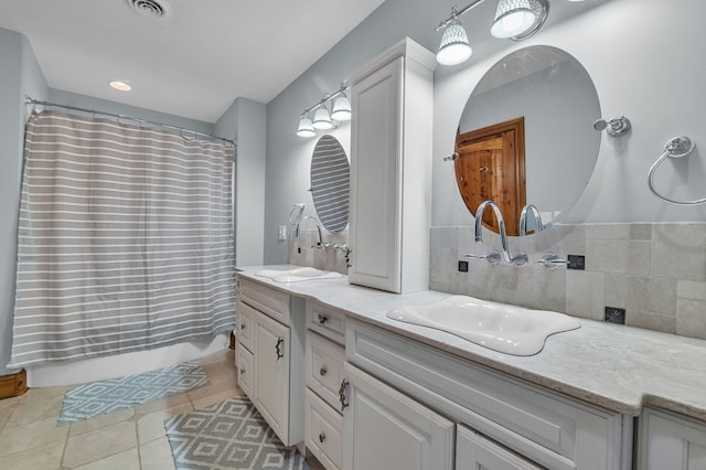 18549 Landridge Way, Abingdon, VA 24211 - full bath with double vanity, tile patterned floors, curtained shower, and decorative backsplash