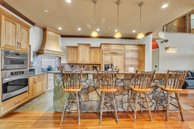 18549 Landridge Way, Abingdon, VA 24211 - kitchen with premium range hood, double oven, a kitchen breakfast bar, light stone counters, and recessed lighting