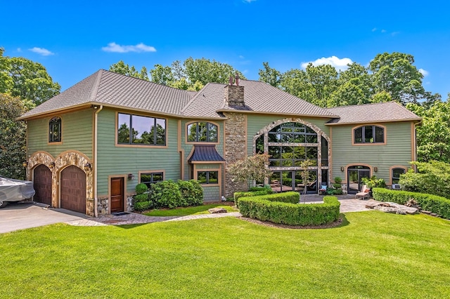 18549 Landridge Way, Abingdon, VA 24211 - view of front of property featuring a garage, a front yard, stone siding, and a metal roof