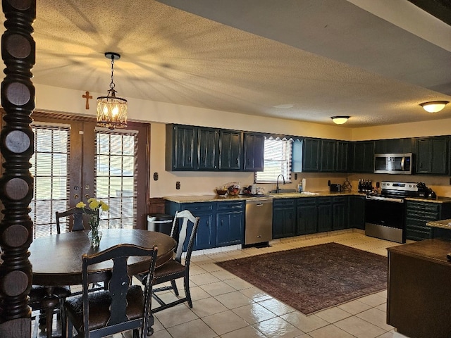 419 Tanglewood Dr, Glade Spring, VA 24340 - kitchen with decorative light fixtures, an inviting chandelier, a sink, light countertops, and appliances with stainless steel finishes