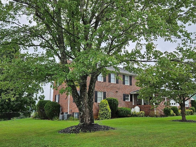 419 Tanglewood Dr, Glade Spring, VA 24340 - colonial-style house with a front lawn and fence