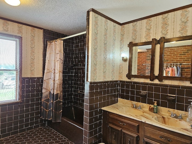 419 Tanglewood Dr, Glade Spring, VA 24340 - bathroom featuring wainscoting, tile walls, a healthy amount of sunlight, and wallpapered walls