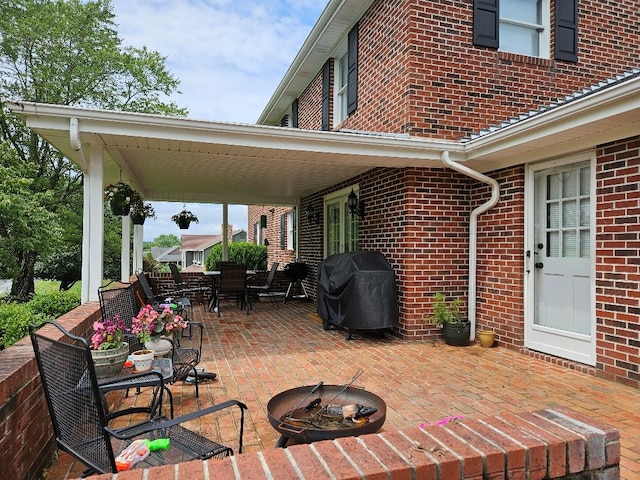 419 Tanglewood Dr, Glade Spring, VA 24340 - view of patio featuring area for grilling, outdoor dining space, and a fire pit