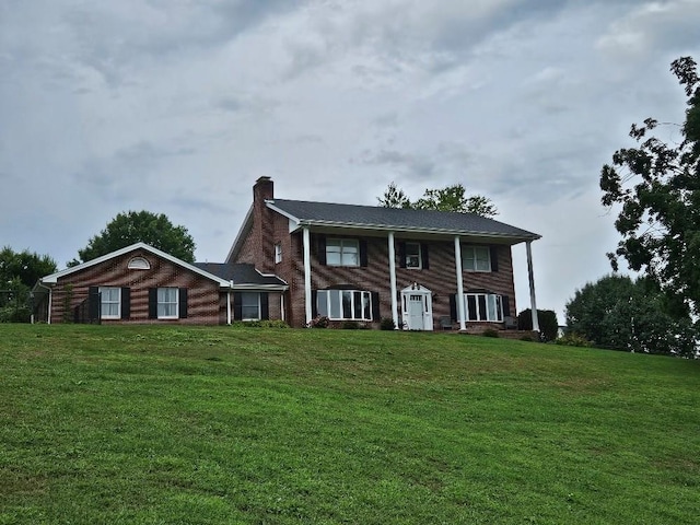 419 Tanglewood Dr, Glade Spring, VA 24340 - greek revival house with a front lawn and a chimney