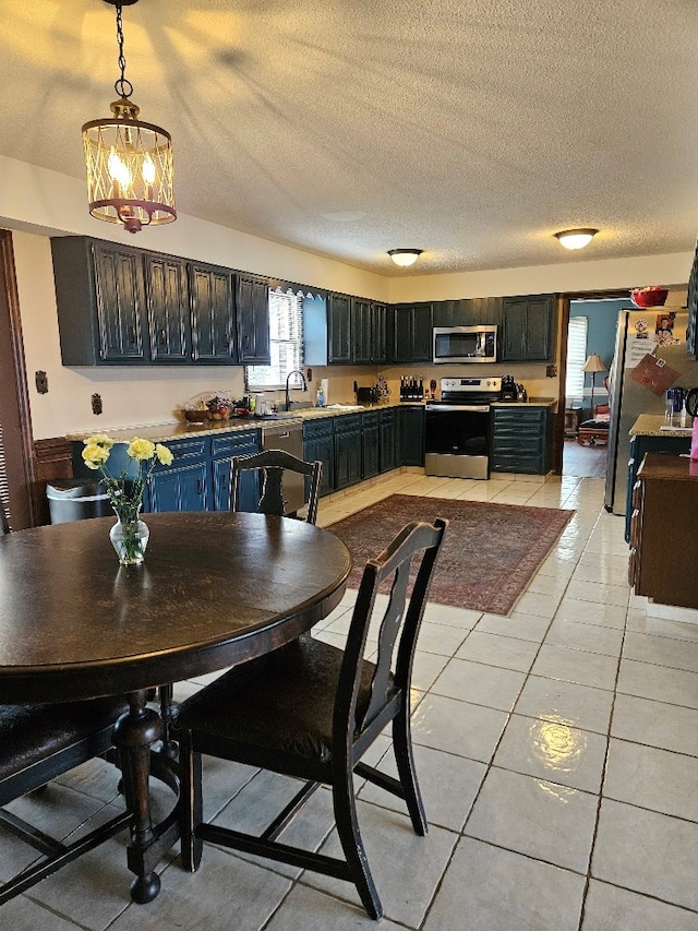 419 Tanglewood Dr, Glade Spring, VA 24340 - dining room with a textured ceiling, a chandelier, and light tile patterned floors