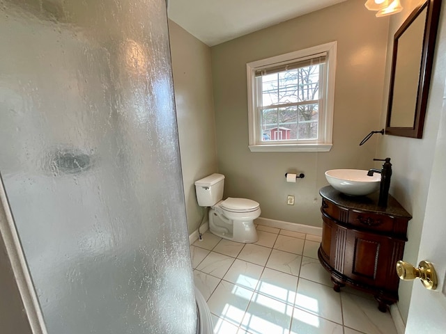 full bathroom with vanity, toilet, baseboards, tile patterned floors, and walk in shower