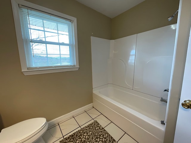 full bath featuring toilet, shower / tub combination, and baseboards