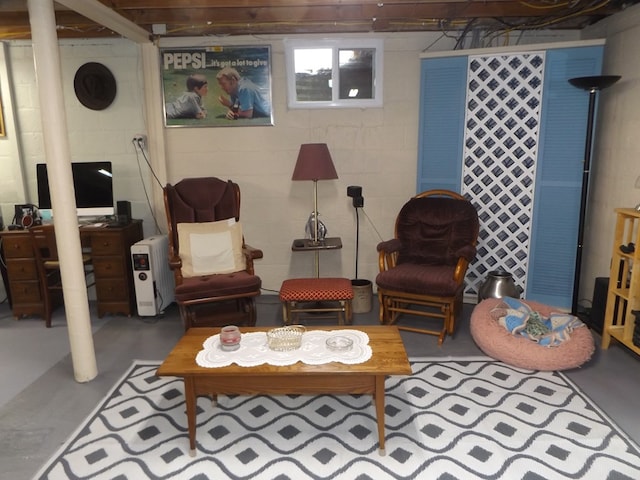 living area with concrete flooring