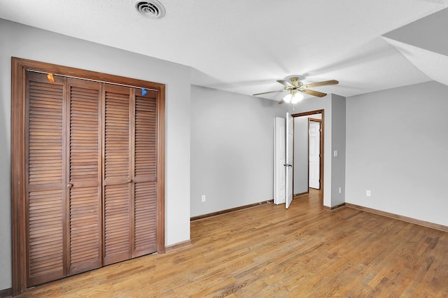 178 Woodside Dr, Chilhowie, VA 24319 - unfurnished bedroom with light wood finished floors, baseboards, a ceiling fan, and a closet
