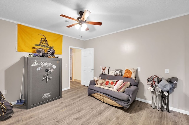178 Woodside Dr, Chilhowie, VA 24319 - sitting room featuring light wood-style floors, ceiling fan, crown molding, baseboards, and a textured ceiling