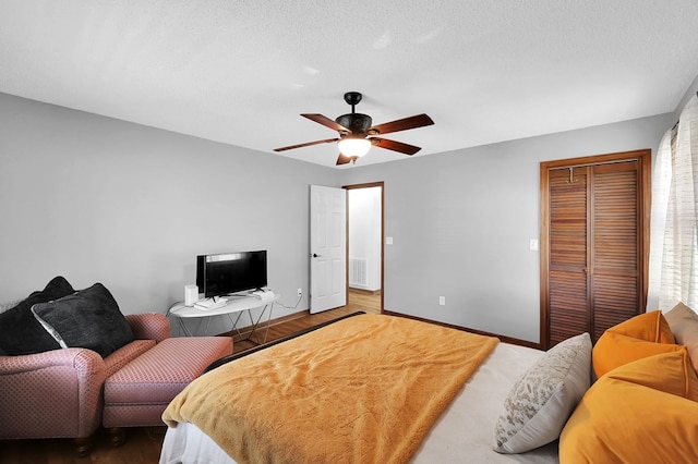 178 Woodside Dr, Chilhowie, VA 24319 - bedroom featuring a closet, baseboards, wood finished floors, and ceiling fan