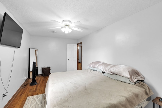 178 Woodside Dr, Chilhowie, VA 24319 - bedroom with a textured ceiling, wood finished floors, and a ceiling fan