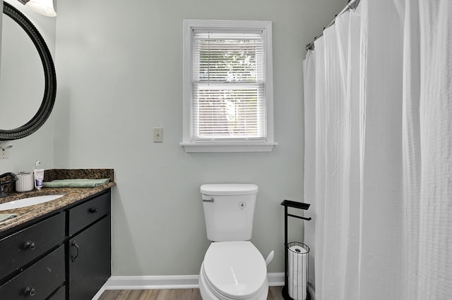 178 Woodside Dr, Chilhowie, VA 24319 - full bathroom featuring toilet, baseboards, vanity, and wood finished floors