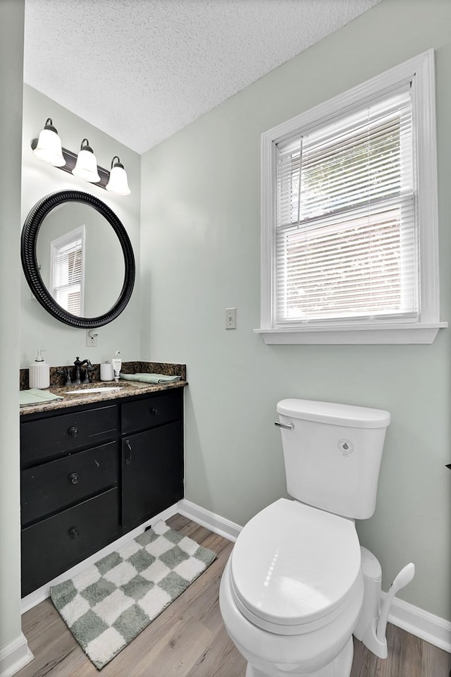 178 Woodside Dr, Chilhowie, VA 24319 - half bathroom featuring baseboards, wood finished floors, toilet, and a textured ceiling