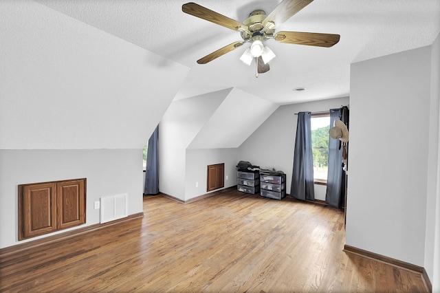 178 Woodside Dr, Chilhowie, VA 24319 - additional living space with wood finished floors, vaulted ceiling, a ceiling fan, and baseboards