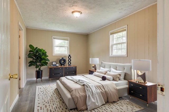 103 Whites Subdivision Rd, Cedar Bluff, VA 24609 - bedroom featuring ornamental molding, a textured ceiling, wood finished floors, and baseboards