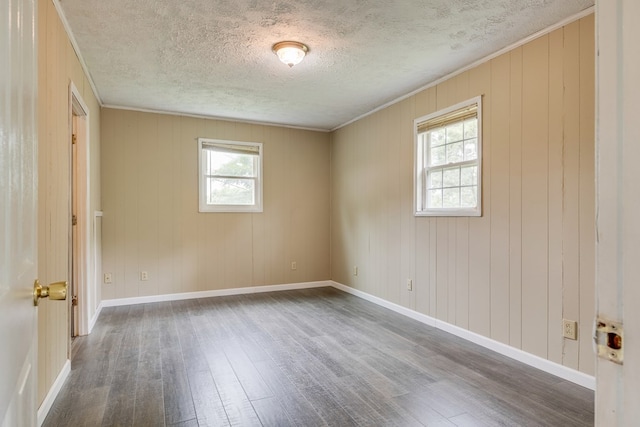 103 Whites Subdivision Rd, Cedar Bluff, VA 24609 - unfurnished room featuring wood finished floors, a textured ceiling, ornamental molding, and baseboards