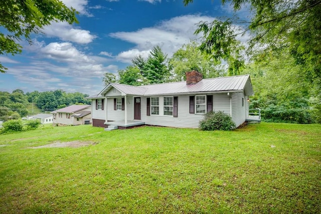 103 Whites Subdivision Rd, Cedar Bluff, VA 24609 - single story home with a chimney, metal roof, and a front lawn