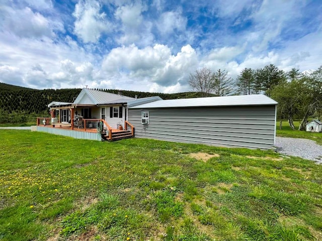 232 Echo Ridge Ln, Elk Creek, VA 24326 - rear view of property featuring a deck and a lawn