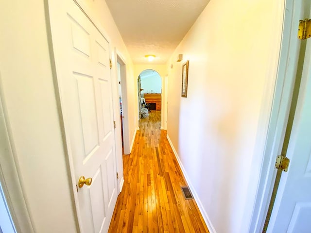 1476 E Blue Grass Trl, Bland, VA 24315 - corridor with arched walkways, light wood-style floors, and baseboards