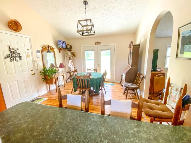 1476 E Blue Grass Trl, Bland, VA 24315 - dining space featuring a textured ceiling, french doors, healthy amount of natural light, and light wood finished floors