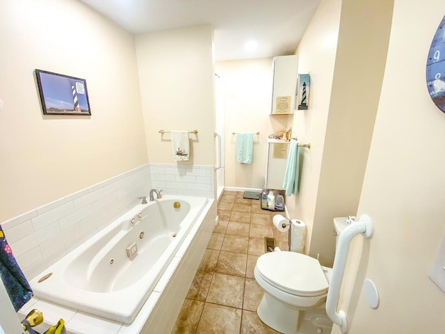 1476 E Blue Grass Trl, Bland, VA 24315 - bathroom featuring a tub with jets, toilet, and tile patterned floors