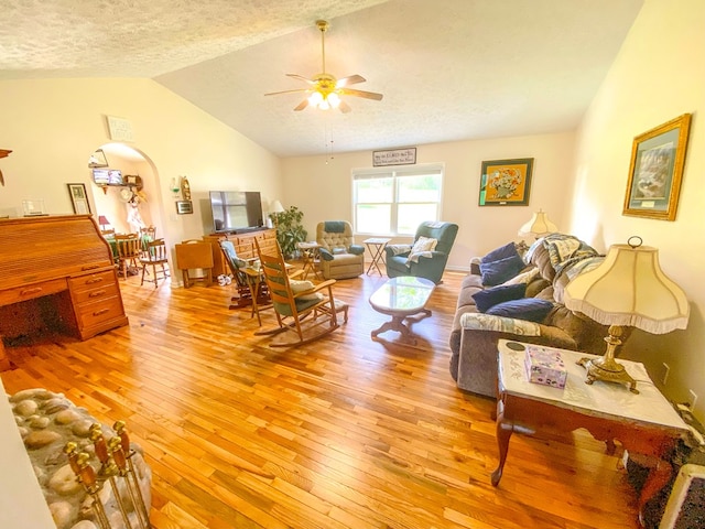 1476 E Blue Grass Trl, Bland, VA 24315 - living area with light wood finished floors, vaulted ceiling, ceiling fan, and a textured ceiling