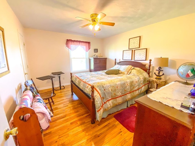 1476 E Blue Grass Trl, Bland, VA 24315 - bedroom featuring light wood-style flooring, a ceiling fan, and baseboards