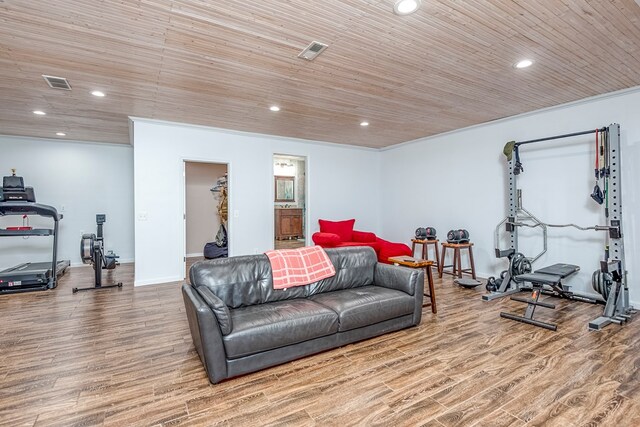 living area featuring wooden ceiling, wood finished floors, and visible vents