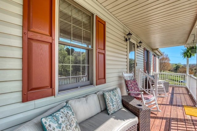 wooden terrace with a porch