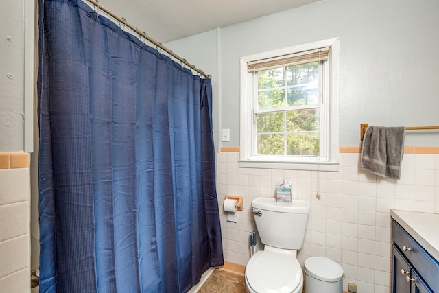 9433 Legend Dr, Glade Spring, VA 24340 - bathroom featuring vanity, wainscoting, tile walls, and a shower with shower curtain