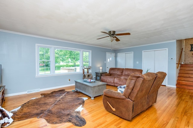 9433 Legend Dr, Glade Spring, VA 24340 - living room with stairway, ceiling fan, light wood finished floors, and ornamental molding