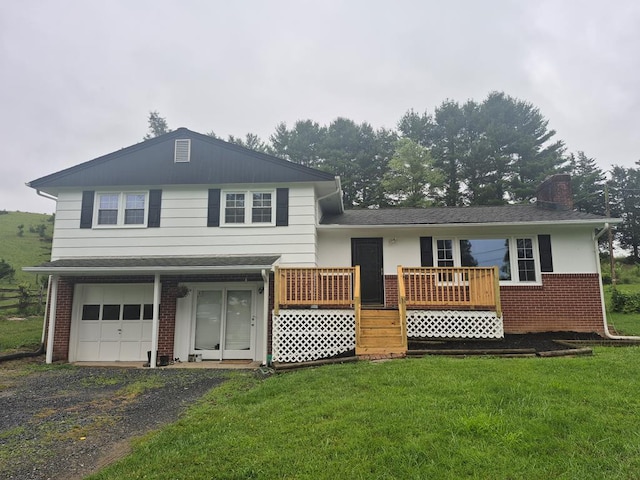 9433 Legend Dr, Glade Spring, VA 24340 - view of front of house with brick siding, a chimney, a front lawn, and an attached garage