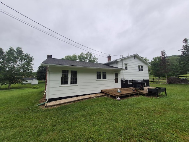 9433 Legend Dr, Glade Spring, VA 24340 - rear view of house with a chimney, a deck, and a yard