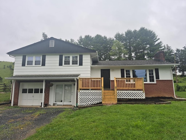 9433 Legend Dr, Glade Spring, VA 24340 - view of front facade featuring brick siding, a front lawn, a chimney, a garage, and a wooden deck