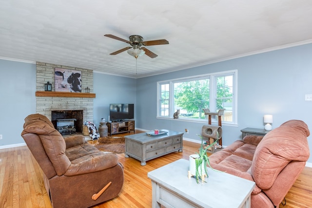 9433 Legend Dr, Glade Spring, VA 24340 - living area featuring a ceiling fan, light wood-style flooring, ornamental molding, and a fireplace
