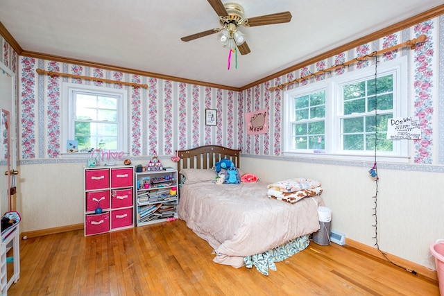 9433 Legend Dr, Glade Spring, VA 24340 - bedroom featuring wainscoting, wallpapered walls, multiple windows, hardwood / wood-style floors, and ornamental molding