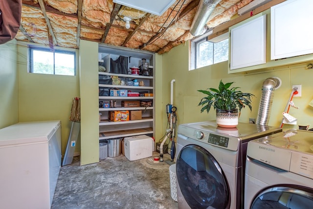 9433 Legend Dr, Glade Spring, VA 24340 - laundry room with independent washer and dryer, cabinet space, and plenty of natural light