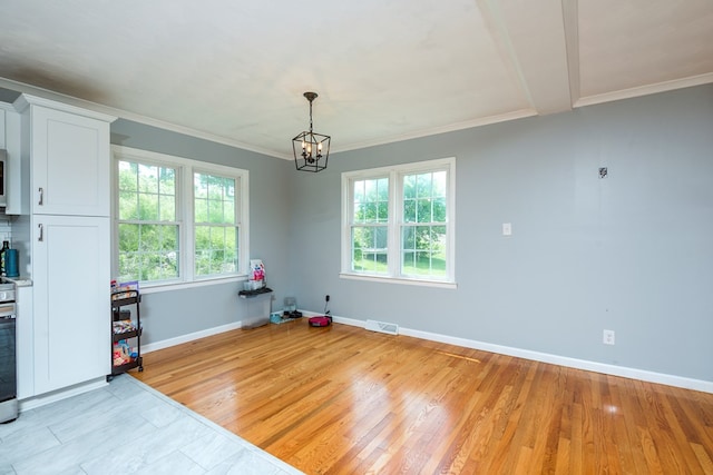 9433 Legend Dr, Glade Spring, VA 24340 - unfurnished dining area featuring a chandelier, healthy amount of natural light, crown molding, and light wood finished floors