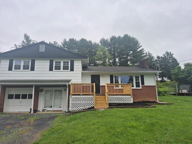 9433 Legend Dr, Glade Spring, VA 24340 - tri-level home with a front lawn, brick siding, a chimney, a garage, and a wooden deck